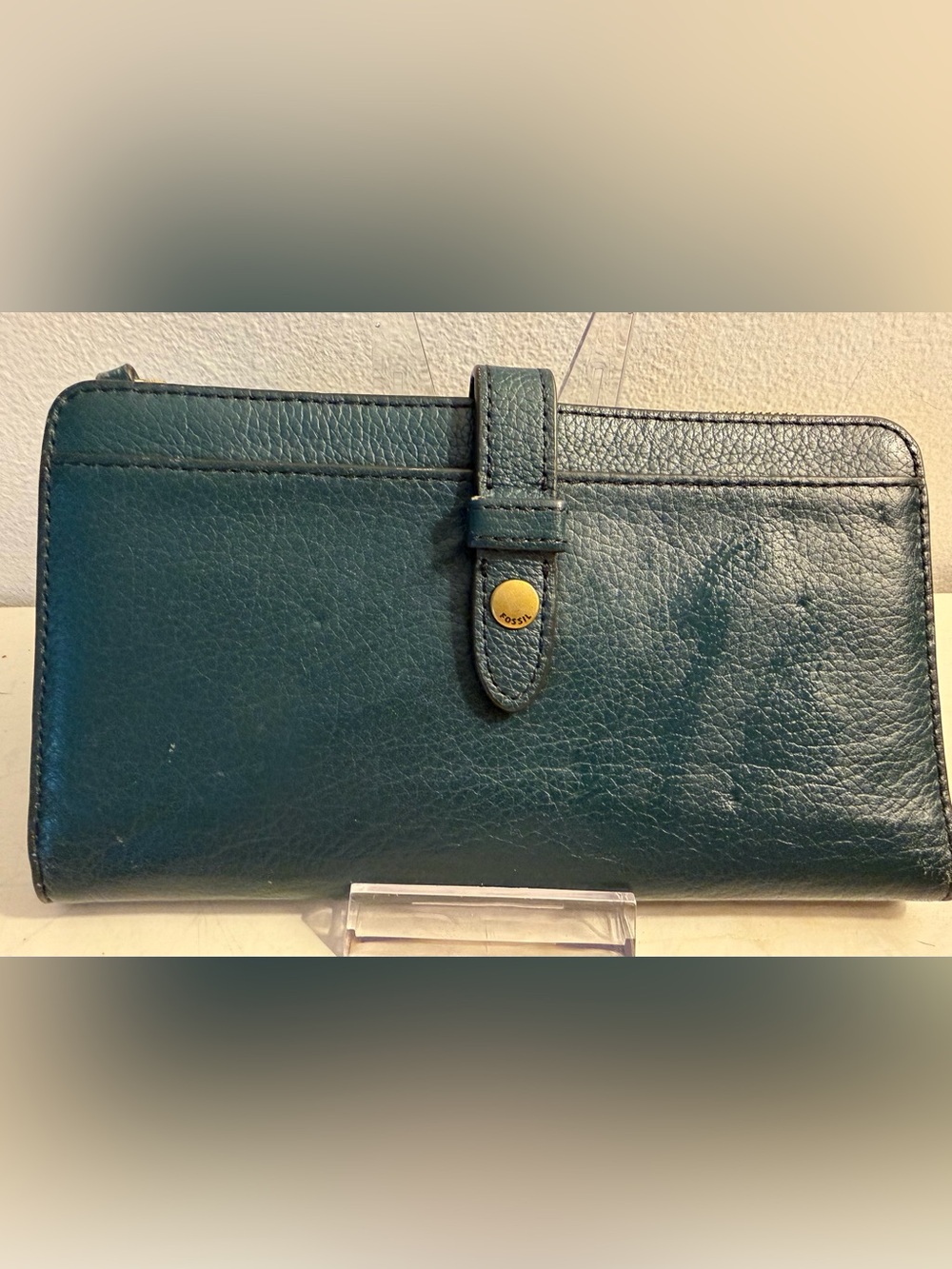 Fossil green leather wallet.